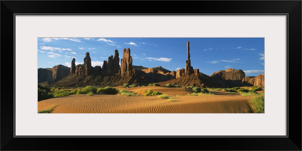 Rock formations on a landscape, Totem Pole Rock, Yei Bi Chei, Monument Valley Tribal Park, Arizona