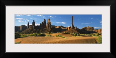 Rock formations on a landscape, Totem Pole Rock, Yei Bi Chei, Monument Valley Tribal Park, Arizona