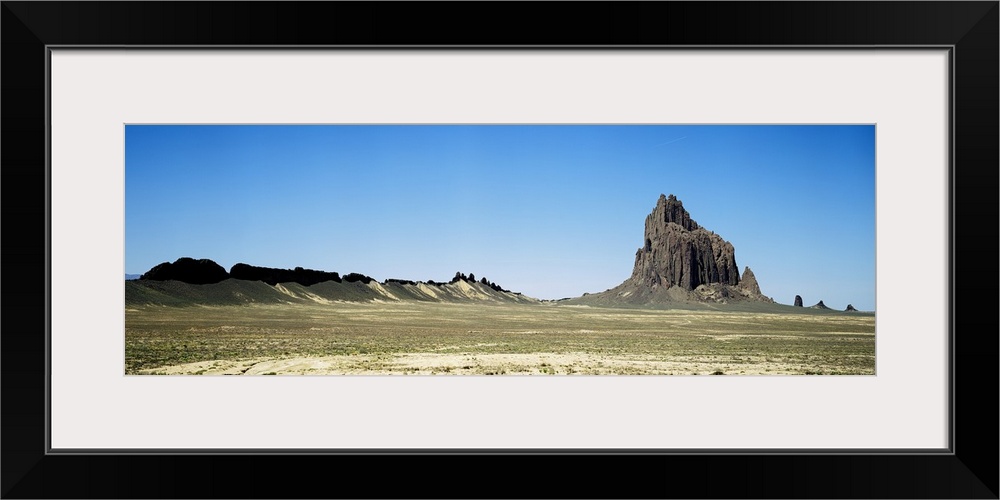 Rock formations on an arid landscape Ship Rock San Juan County New Mexico