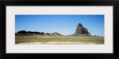 Rock formations on an arid landscape Ship Rock San Juan County New Mexico