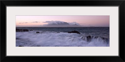 Rocks in the sea with Table Mountain in the background, Bloubergstrand, Table Mountain, Cape Town, Western Cape Province, Republic of South Africa