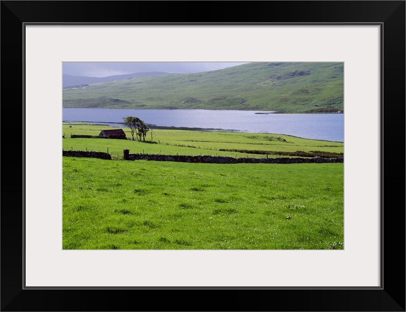 Rural countryside with lake, Ireland.