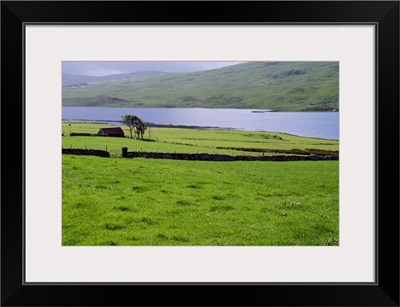 Rural countryside with lake, Ireland.