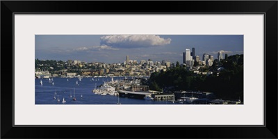 Sailboats in a lake with a city in the background, Lake Union, Seattle, Washington State