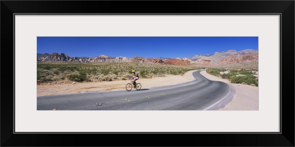 Side profile of a person cycling on a road, Red Rock Canyon National Conservation Area, Clark County, Nevada