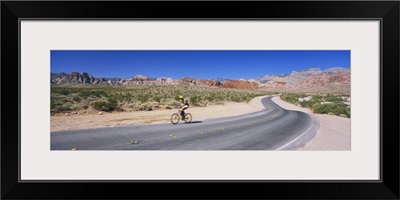 Side profile of a person cycling on a road, Red Rock Canyon National Conservation Area, Clark County, Nevada