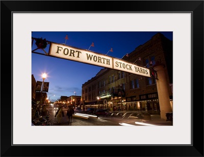 Signboard over a road at dusk, Fort Worth Stockyards, Fort Worth, Texas