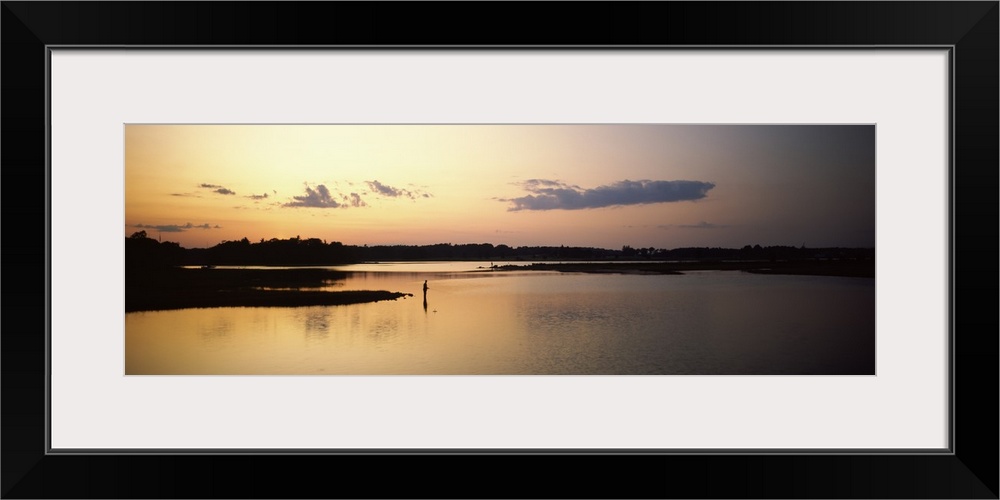 Silhouette of a person fishing in a lake at dusk, Rye, Rockingham County, New Hampshire