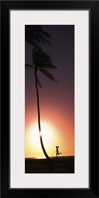 Silhouette of a woman running on the beach, Magic Island, Hawaii