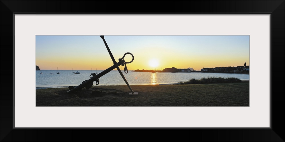 Silhouette of an anchor on the beach at sunrise, North Berwick, East Lothian, Scotland