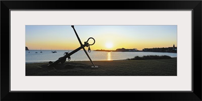 Silhouette of an anchor on the beach at sunrise, North Berwick, East Lothian, Scotland