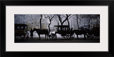 Silhouette of horse drawn carriages, Chicago, Illinois