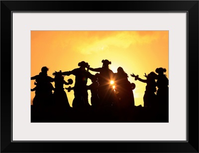 Silhouette of hula dancers at sunrise, Molokai, Hawaii