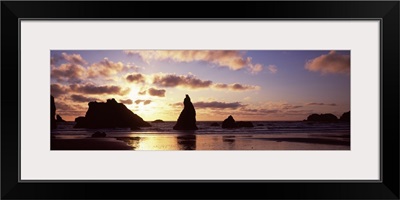 Silhouette of rock formation in the ocean Bandon Beach Bandon Coos County Oregon