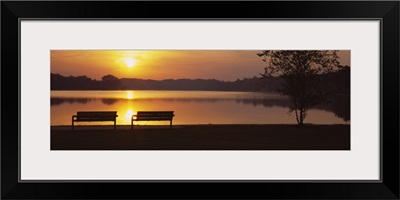 Silhouette of two benches along a lake, Reeds Lake, Grand Rapids, Michigan
