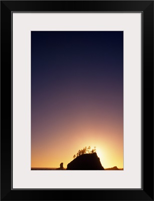 Silhouetted Sea Stack In Pacific Ocean