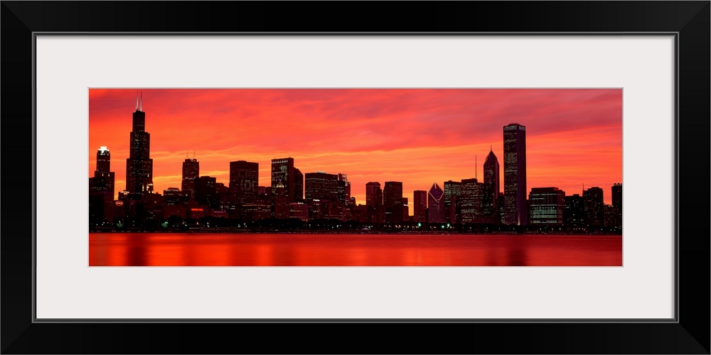 Giant landscape wall picture of the Chicago skyline at dusk, reflecting in the waters of Lake Michigan.