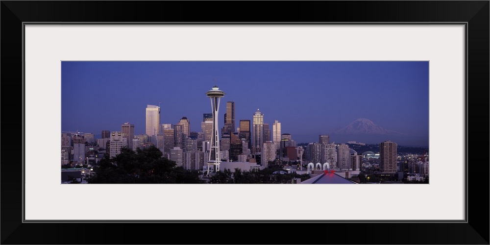 A panoramic view of the Seattle skyline with the space needle focused in the middle.