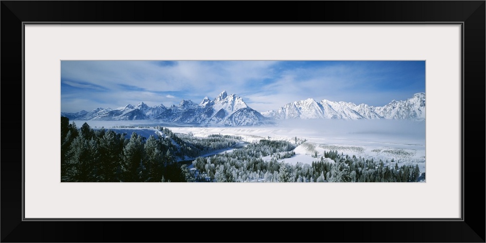 This is a panoramic photograph of the snowscape surrounding these Montana mountain peaks in winter.