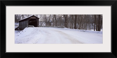 Snow covered bridge in a forest, Grand Rapids, Kent County, Michigan