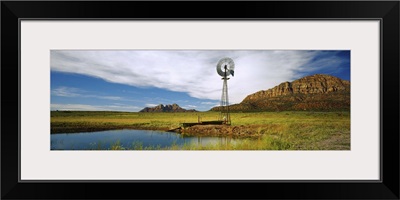 Solitary windmill near a pond, U.S. Route 89, Utah