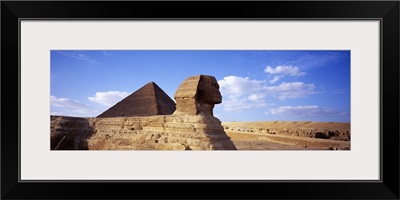 Sphinx in front of a pyramid, Great Pyramid, Giza, Cairo, Egypt