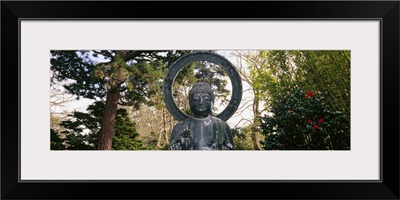 Statue of Buddha in a park, Japanese Tea Garden, Golden Gate Park, San Francisco, California