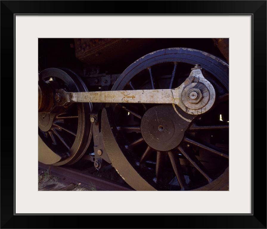 Up-close photograph of wheels on a train.