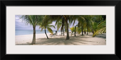 Sunning tourists on 7-Mile Beach, Negril, Jamaica