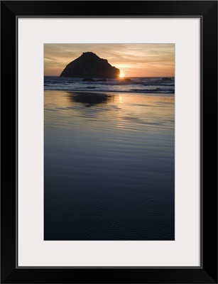 Sunset behind silhouetted sea stack on Bandon Beach, Bandon Beach State Park, Oregon