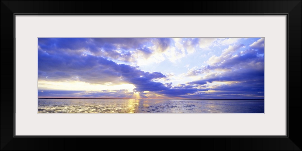 Panoramic photo print of a sunset over an ocean.