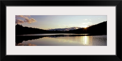 Sunset over mountains, Upper Brown Tract Pond, Adirondack Mountains, New York State,