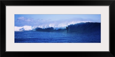 Surfer surfing in the ocean, Tahiti, French Polynesia