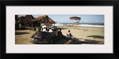 Surfers watching waves, Zicatela Beach, Mexcio