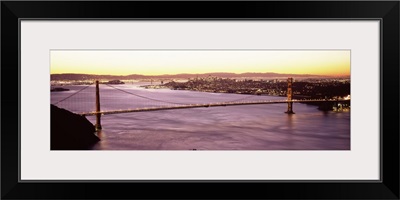 Suspension bridge lit up at dusk Golden Gate Bridge San Francisco Bay San Francisco California