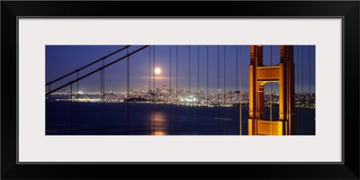 Suspension bridge lit up at night, Golden Gate Bridge, San Francisco, California