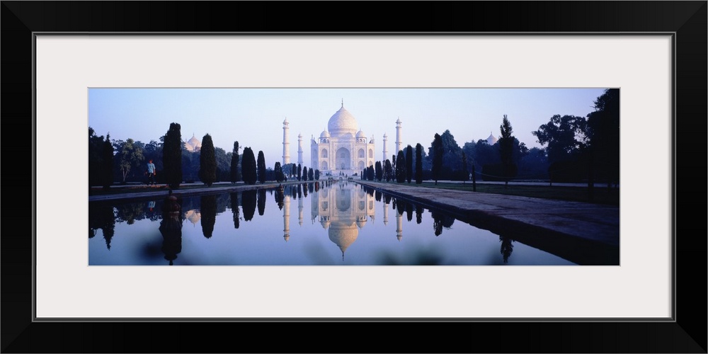 Panoramic photo on canvas of the Taj Mahal with a reflecting pool in front.
