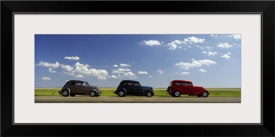 Three Hot Rods moving on a highway, Route 66,