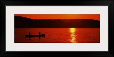 Tourists canoeing in a lake at sunset, Oquaga Lake, Deposit, Broome County, New York State