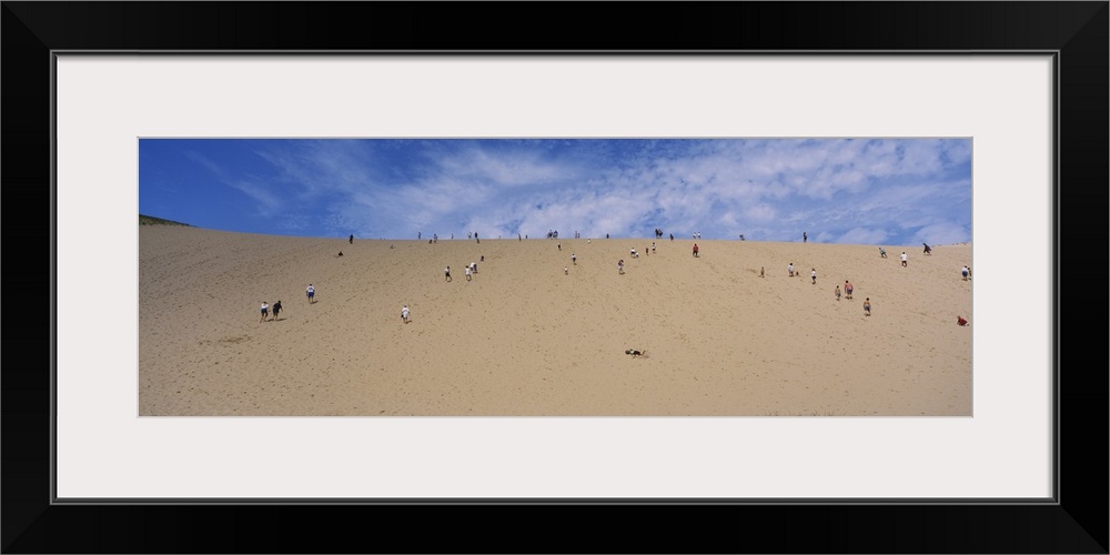 Tourists climbing a sand dune, Sleeping Bear Dunes National Lakeshore, Michigan