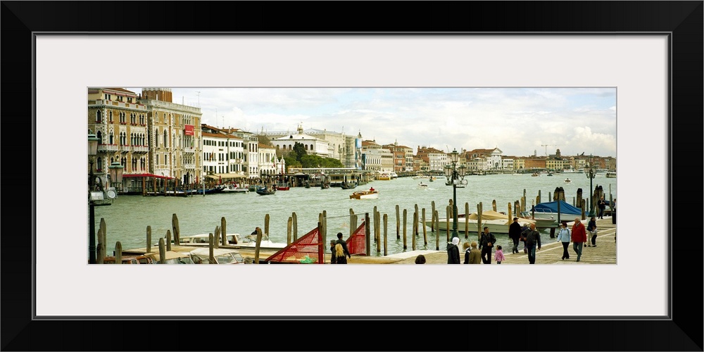 Tourists walking along a canal, Grand Canal, Fondamenta Della Dogana Alla Salute, Dorsoduro, Venice, Veneto, Italy