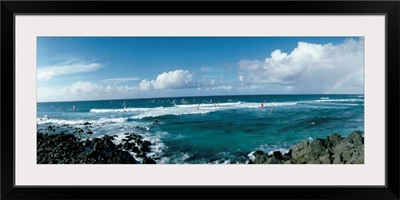 Tourists windsurfing in an ocean, California