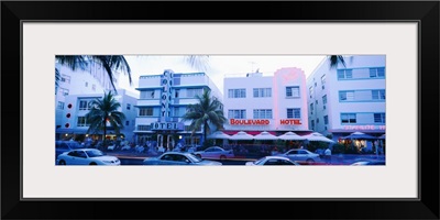 Traffic on road in front of hotels, Ocean Drive, Miami, Florida