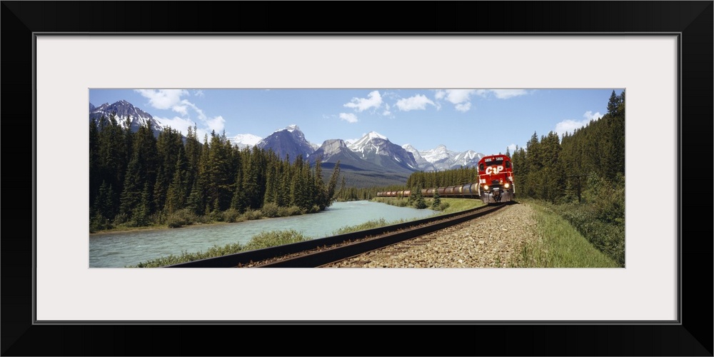 Train on a railroad track, Morants Curve, Banff National Park, Alberta, Canada