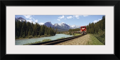 Train on a railroad track, Morants Curve, Banff National Park, Alberta, Canada