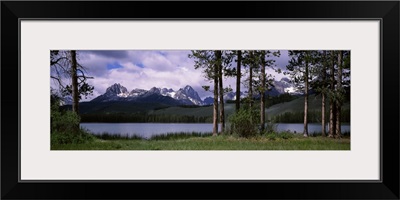 Trees at the lakeside with mountains in the background Little Redfish Lake Sawtooth National Recreation Area Custer County Idaho