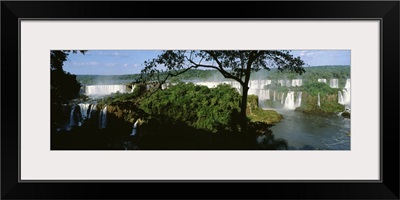 Trees in front of a waterfall, Iguacu Falls, Iguacu National Park, Brazil