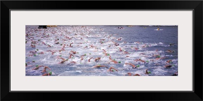 Triathlon athletes swimming in water in a race, Ironman, Kailua Kona, Hawaii