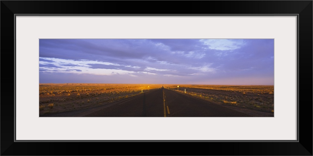 Two lane highway running through a landscape