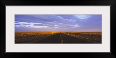 Two lane highway running through a landscape